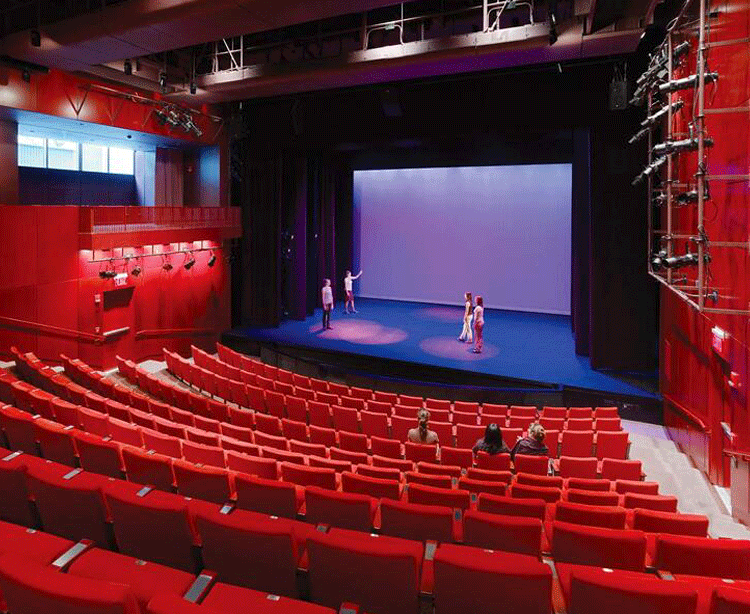 orchestra view of the seating, aisles and elevated entrance in Farkas Hall