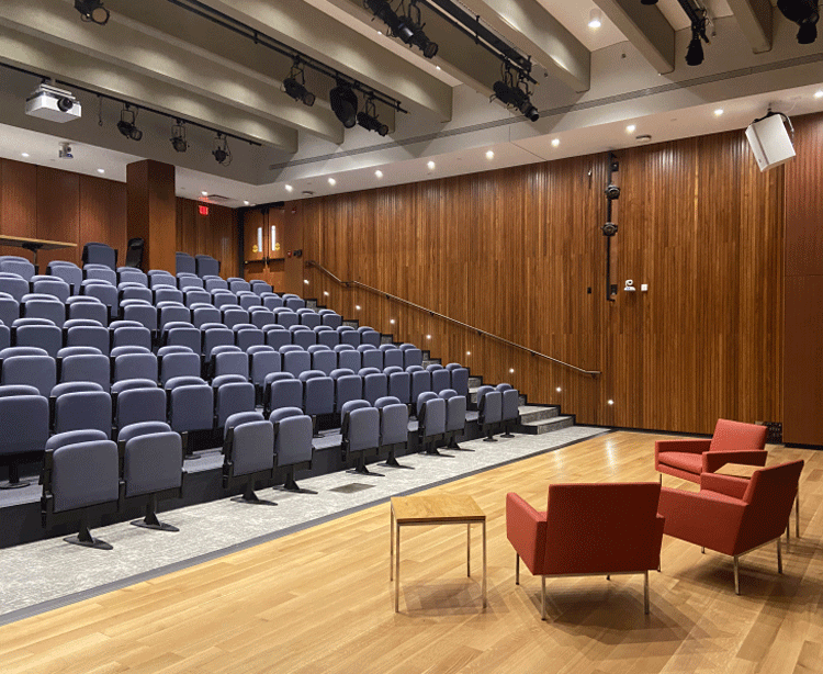 interior view of the graduated seating, aisles and stage in the Student Organization Center at Hilles